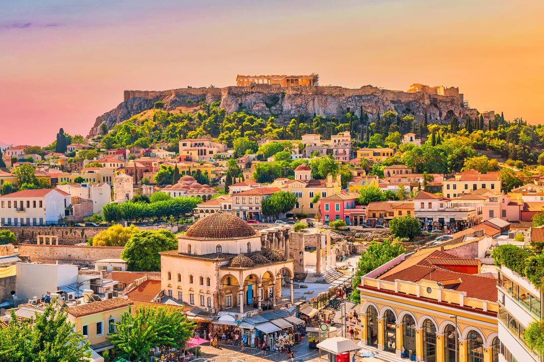 Skyline of Athens with Monastiraki square and Acropolis hill during sunset. Athens, Greece